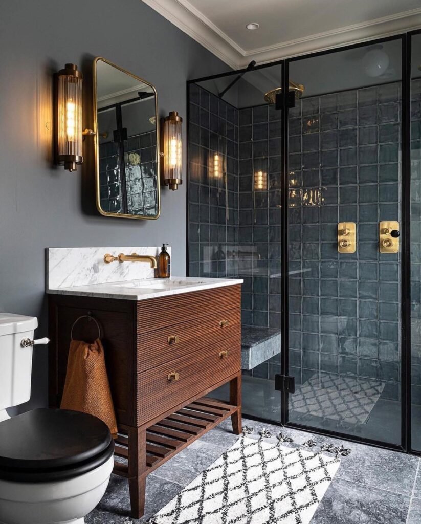 Dark and Moody Bathroom with Gold Accents
