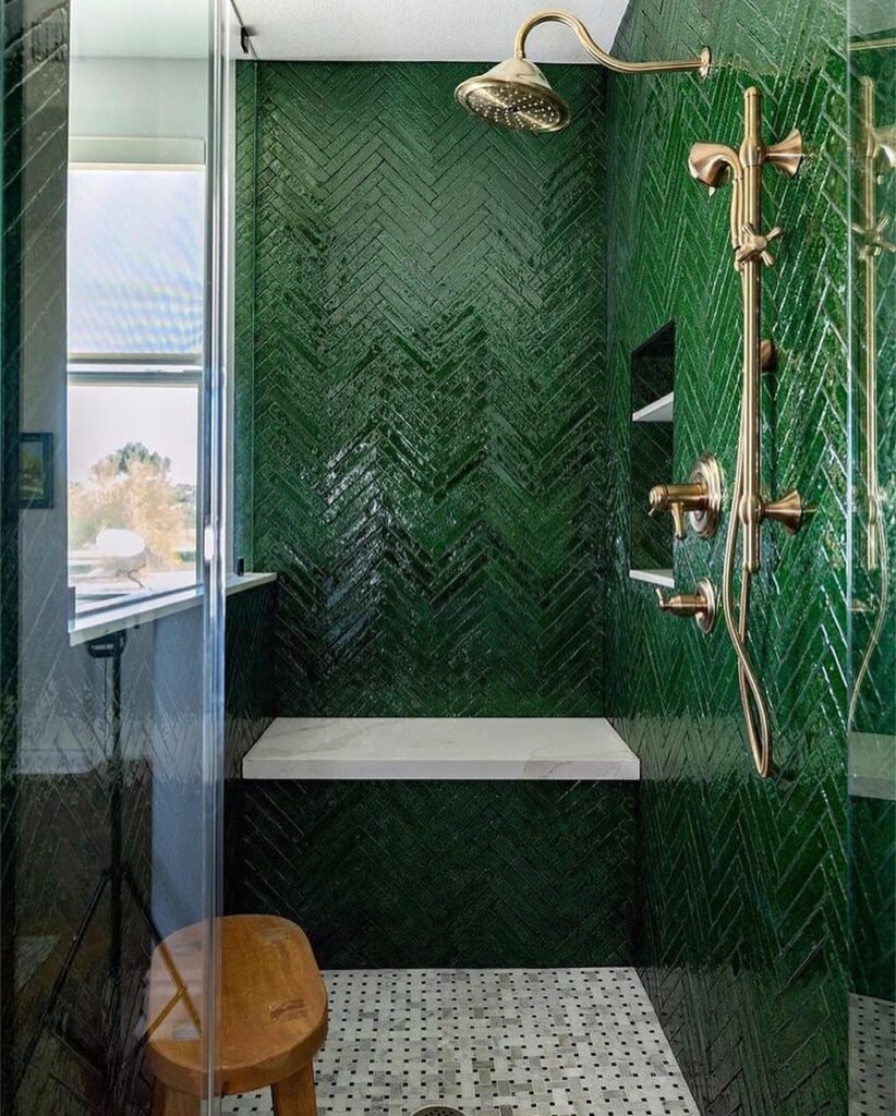 Luxurious Green Tiled Shower with Gold Accents
