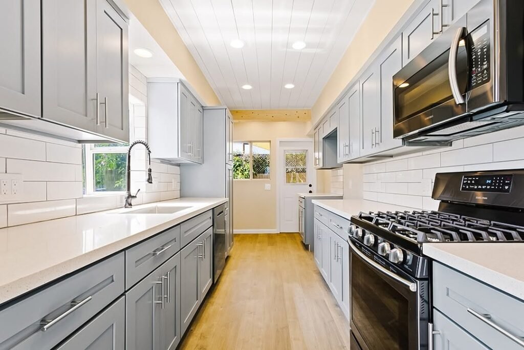 Modern Galley Kitchen with Soft Gray Cabinets
