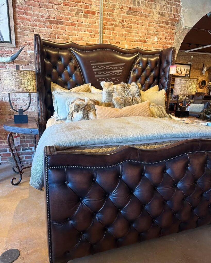 Rustic Western Bedroom with Luxurious Leather & Brick Charm
