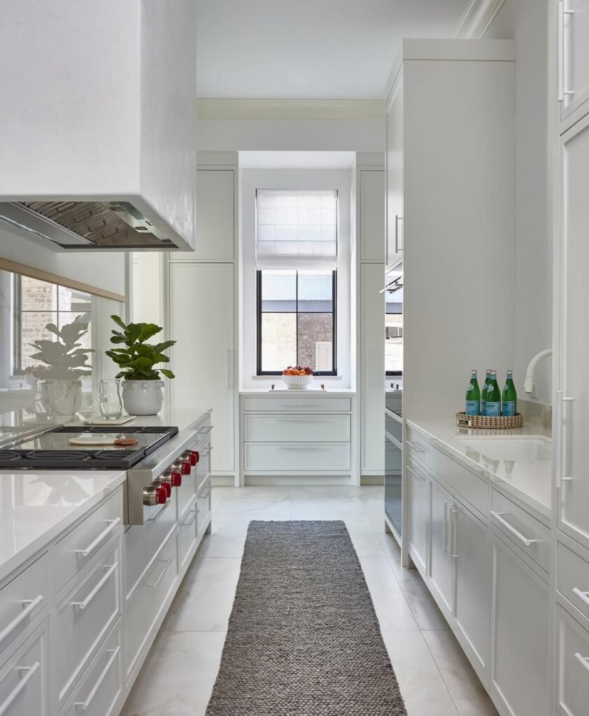 Sleek and Sophisticated All-White Galley Kitchen
