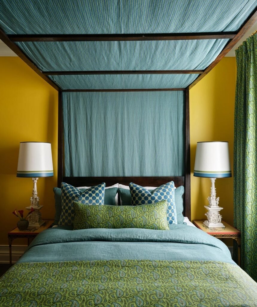 Vibrant Canopy Guest Bedroom with Rich Textures
