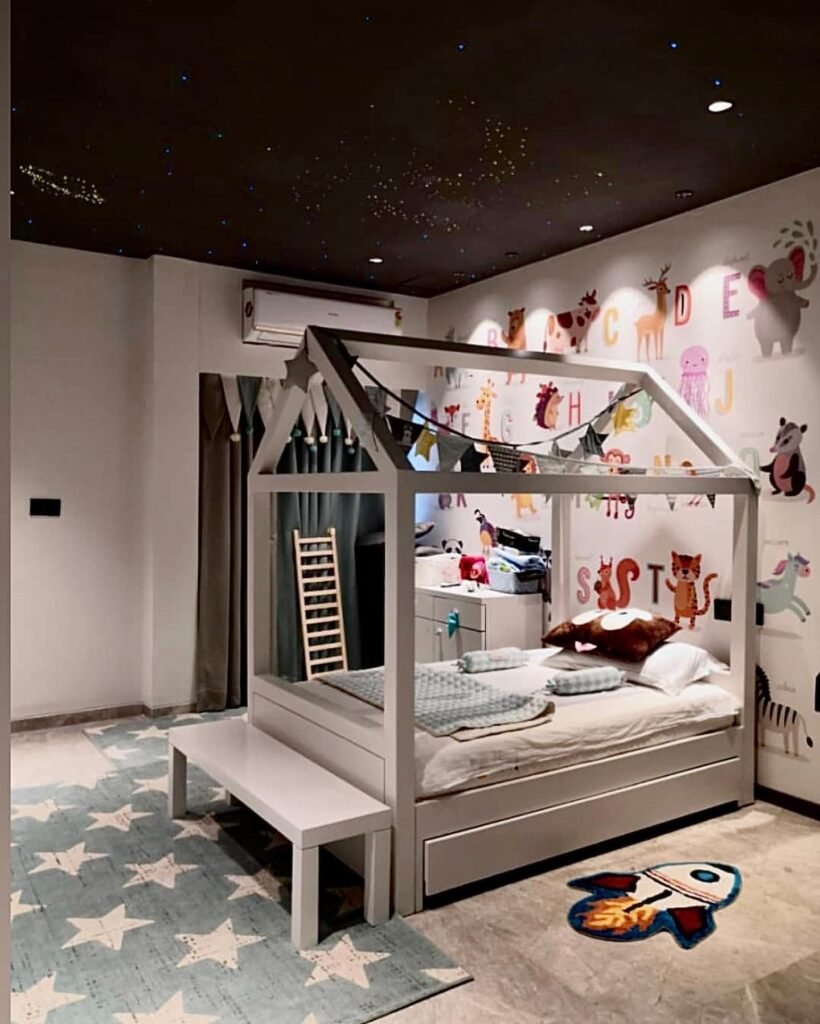 Whimsical House-Themed Bed with a Starry Night Ceiling
