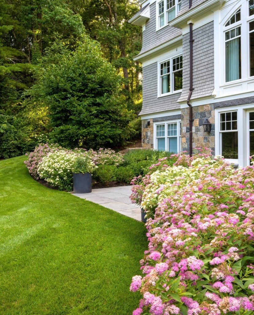 Lush Flower Bed Landscaping for a Timeless Home Exterior
