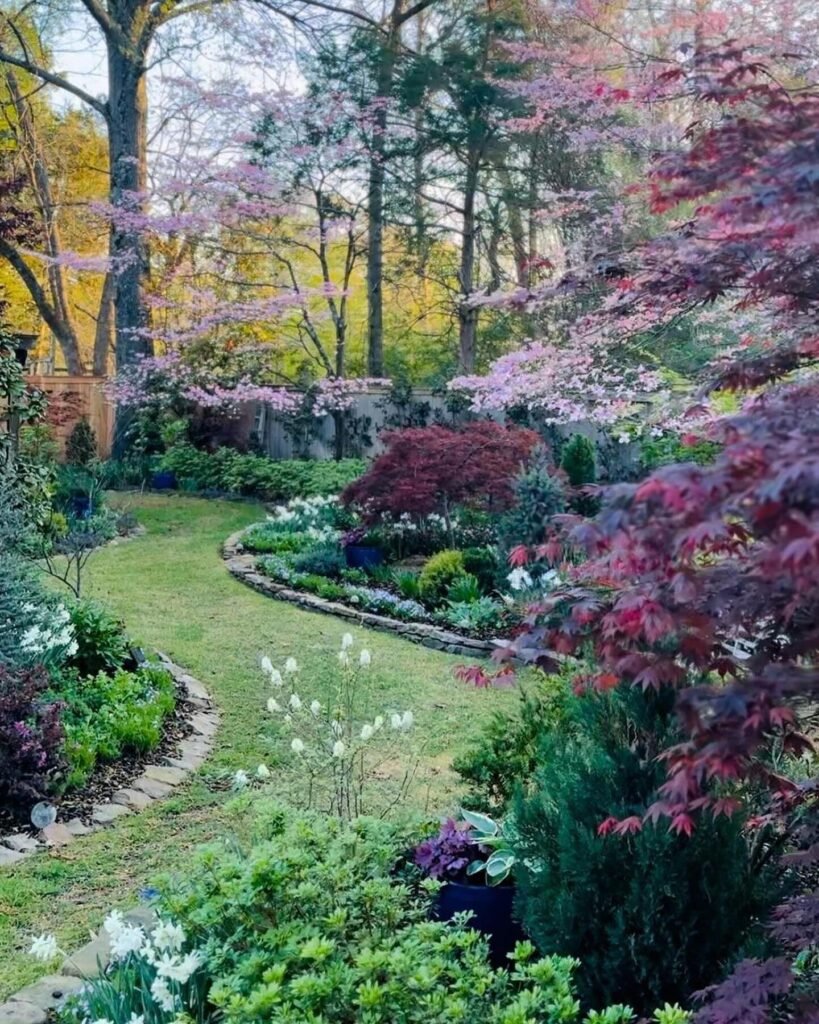 Serene Garden Pathway with Blooming Flower Beds
