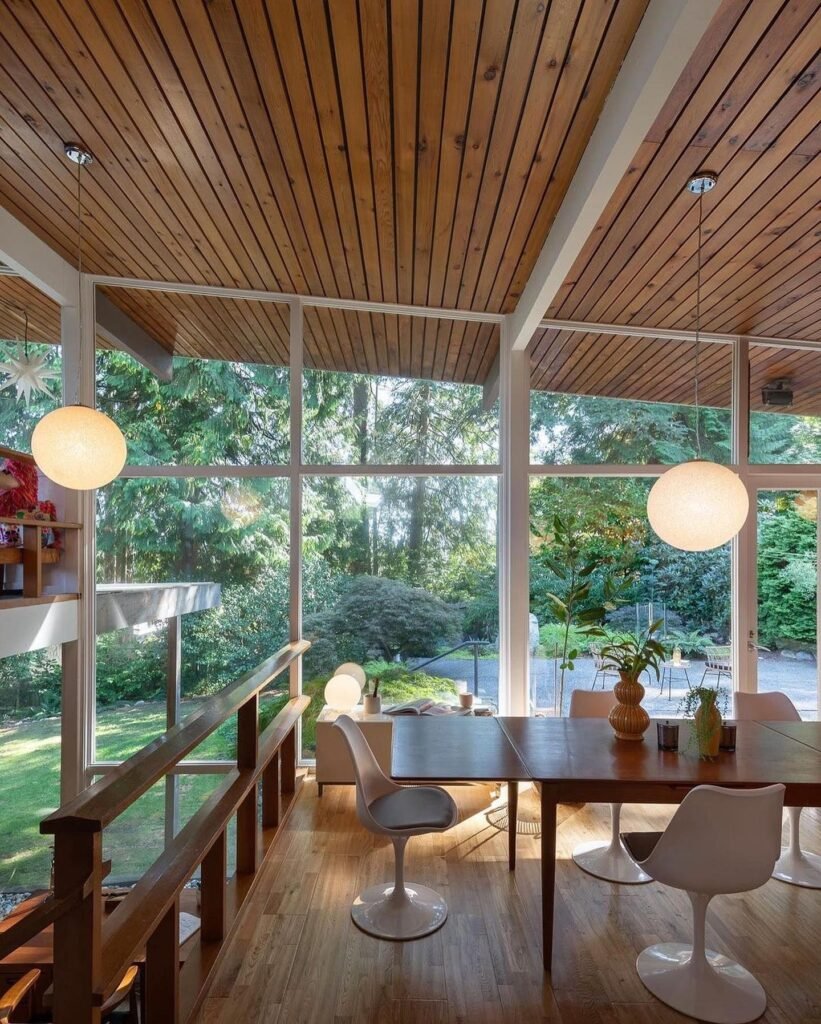 Serene Mid-Century Modern Dining Room with Nature Views
